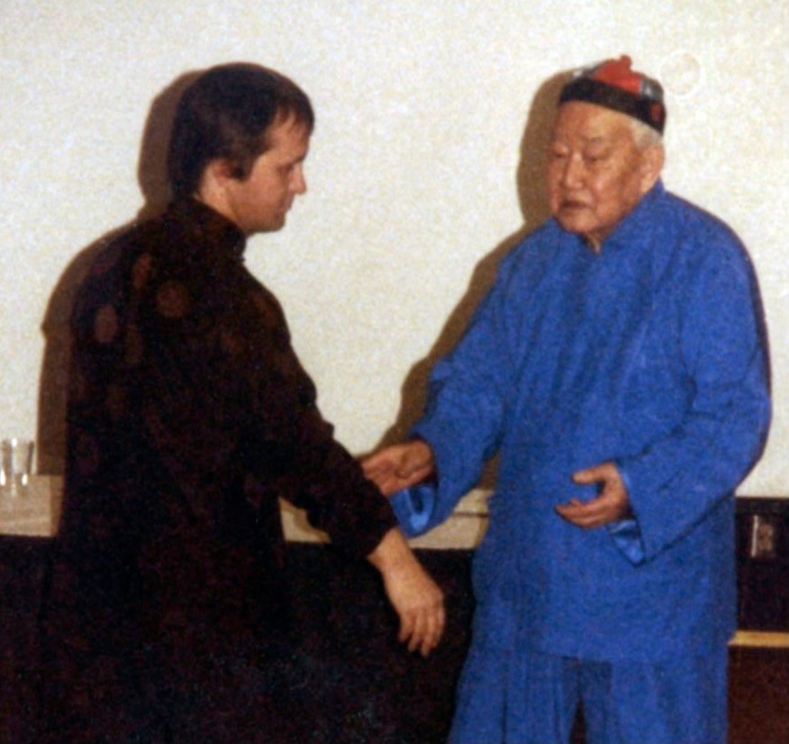 Stuart Alve Olson standing with Tai Chi master T.T. Liang during traditional internal martial arts training