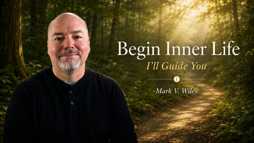 Mark V. Wiley standing beside a forest path inviting visitors to begin the Inner Life journey through embodied practice, awareness, and self-cultivation.