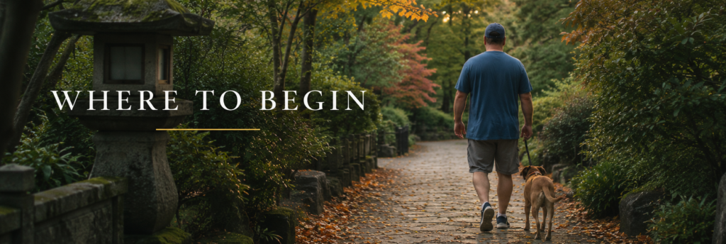 Person walking along a wooded path, symbolizing the beginning of the inner life journey through practice, embodiment, wisdom traditions, and consciousness.