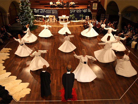 Mevlevi whirling dervishes performing the traditional Sema ceremony, a sacred Sufi practice inspired by the teachings of Jalaluddin Rumi, sect that Peter Huseyin Cunz leads in Switzerland
