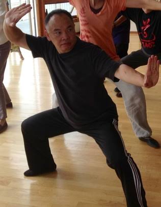 Deng Ming-Dao practicing a traditional Taoist movement posture.