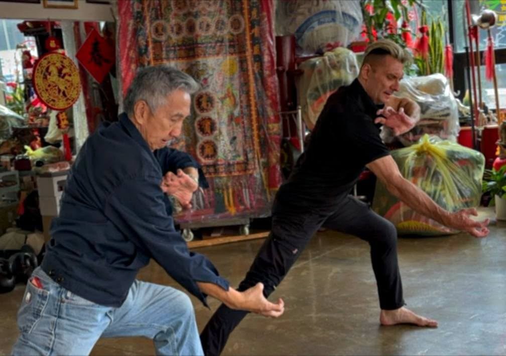 Grandmaster Tak Wah Eng and Master Paul Koh demonstrating a Fu Jow Pai martial arts posture.
