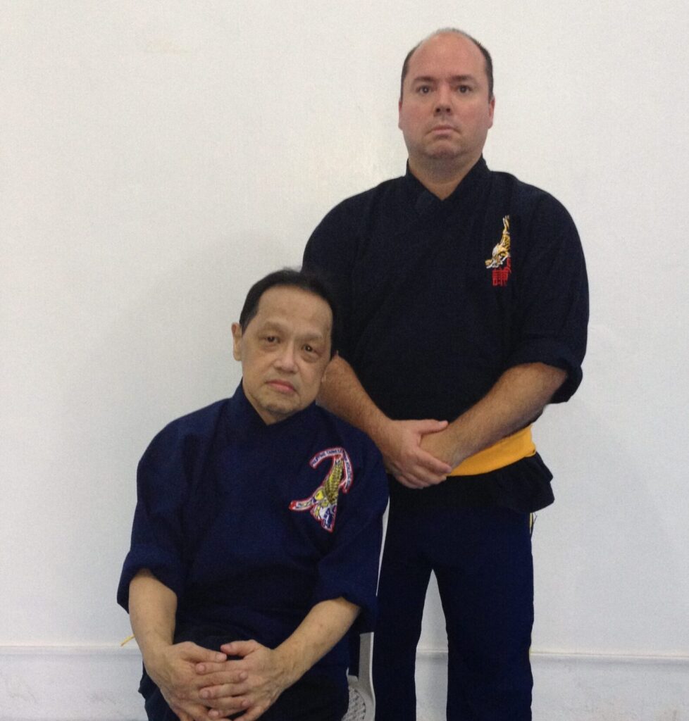 Mark V. Wiley with Ngo Cho Kun master Alex Co during his disciple training in 2013.