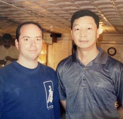 Mark V. Wiley standing with Qigong master Hou FaXiang in 2003.
